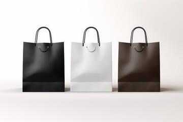 Group of three shopping paper bags with handles on white Background