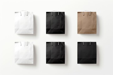 Top View Group black and white shopping paper bags with handles on white Background