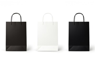 Top View of Group of three black and white paper bags with handles on white Background - Powered by Adobe