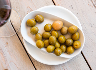 Pickled green olives with a stone - a typical Spanish tapas