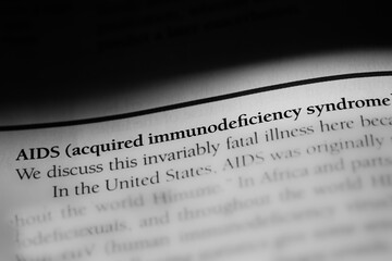 AIDS or acquired immunodeficiency syndrome, highly contagious autoimmune disease, printed in black...