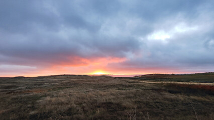 sunrise in the middle of a field as a background or souvenir