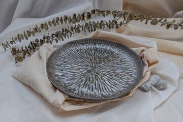 Ceramic Plates with Dried flowers on Calico. Ceramic tableware, Beautiful arrangement.