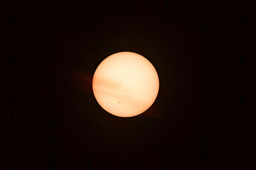A Whispy Cloud Across the Sun with Sun Spots
