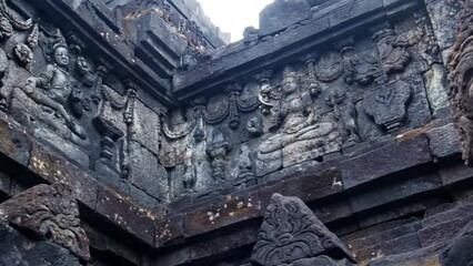 Ornament details and sculptures on the walls of the Buddhist temple Borobudur in Indonesia