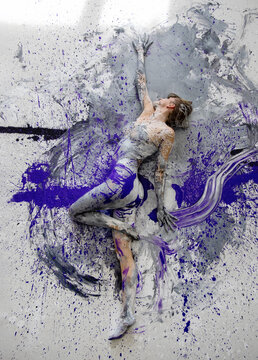 sexy nude artistically abstract painted woman, ballerina with white, gray and purple paint. Creative body art painting