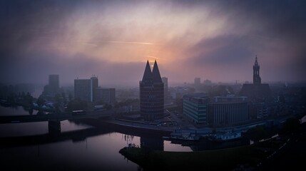 Obraz premium Aerial view of Roermond cityscape at foggy sunset in Netherlands