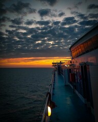 Majestic ship  in an orange-tinted sky  in the North Sea