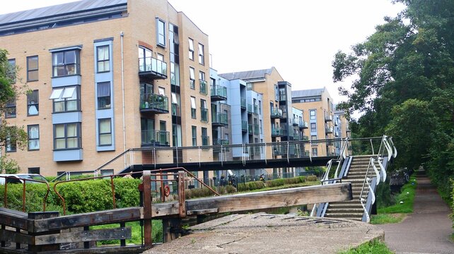 Footbridge with buildings in the background, Apsley, England