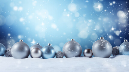 Fototapeta premium Christmas background in blue tones with blue and platinum baubles in the snow