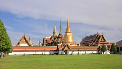 Majestic Temple of the Emerald Buddha stands in a lush green park