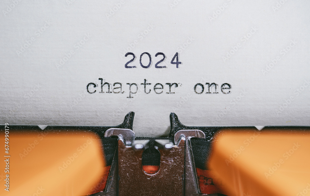 Wall mural old typewriter with following text on paper - 2024 chapter one. new years concept