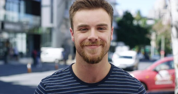 Man, city and blow kiss with smile on face with love, romance or flirting in summer sunshine. Person, outdoor and happy in street, sidewalk or road with pouting lips for kindness, care and freedom