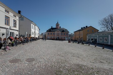 a small square with several benches and buildings in the background
