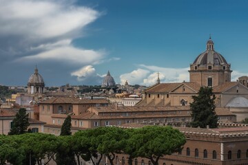 Fototapeta na wymiar Scenic view of domes of old buildings in Piazza Venezia, Rome, Italy