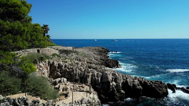 Drone footage of the Coastal Walk - Chemin de Contrebandiers on a sunny day in Antibes, France