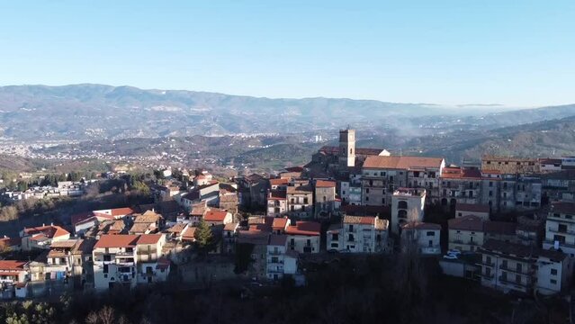 Drone view of buildings of Orte town on a mountain with blue sky in Latium, Italy
