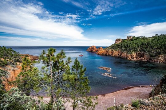 A View From A Rocky Hillside Overlooking The Ocean And Some Cliffs