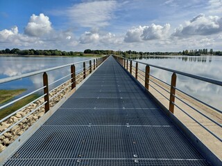Scenic view of a metallic pier on a lake