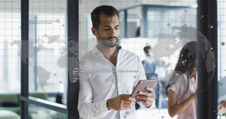 Animation of spinning globe and data processing over middle eastern man using tablet at office - Powered by Adobe