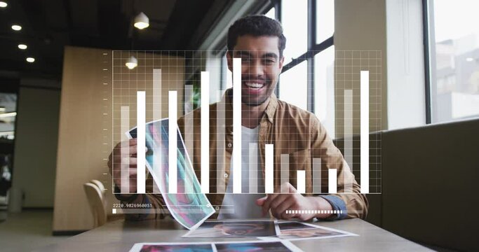 Animation of data processing against biracial man showing documents talking on video call at office