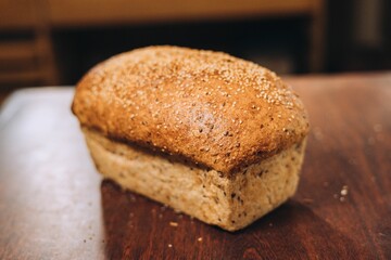 a large loaf of bread sitting on top of a wooden table