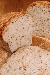 Close-up shot of a freshly sliced loaf of bread on a cutting board