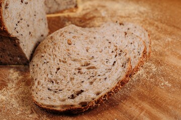 Close-up shot of a freshly sliced loaf of bread on a cutting board