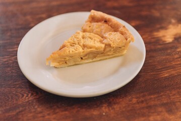 Delicious, freshly-baked cake sits atop a wooden table