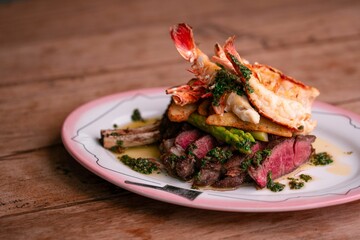 Closeup of steak sliced served with shrimps