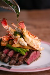 Closeup of steak sliced served with shrimps
