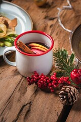 Closeup of a cup of glintwine on a Christmas-themed table