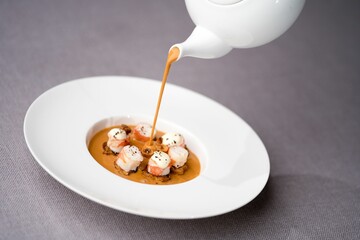 Closeup of a plate of shrimp on toasts with mushrooms