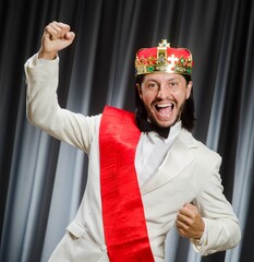 Funny king wearing crown in coronation concept
