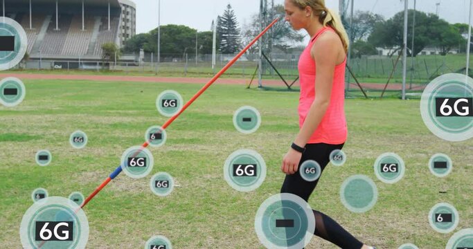 Animation of 6g texts over caucasian female athlete picking up spear from ground
