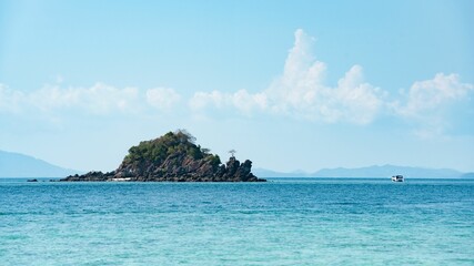 Ccenic view of pure blue sea, boats and distant mountains, Phuket and Phi Phi Island, Thailand