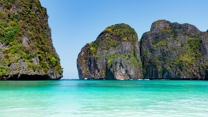 Obraz premium Ccenic view of pure blue sea, boats and distant mountains, Phuket and Phi Phi Island, Thailand
