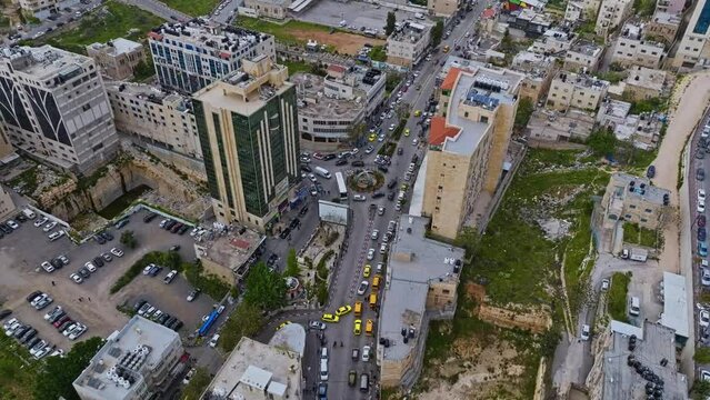 Traffic Jam At Roundabout In Downtown Hebron In Palestinian West Bank. aerial