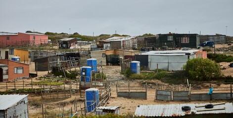 Fototapeta premium Residential area with old houses in Khayelitsha. Western Cape, South Africa.