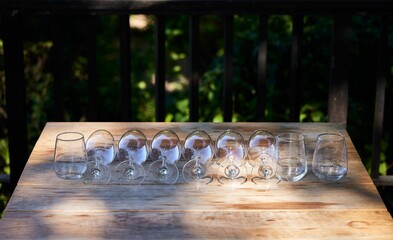 Closeup of Glasses on table of a wine estate in South Africa ready for wine tasting