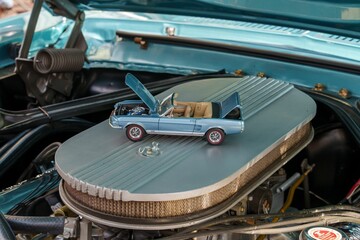 Closeup of a small, gray vintage toy car
