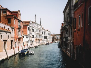 Scenic view of gondolas sailing in a canal of Venice, Italy