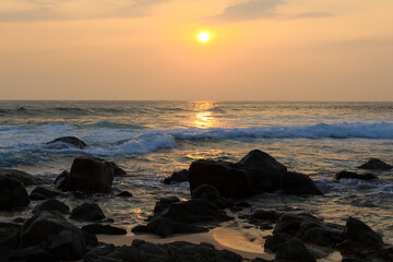 Unawatuna beach in Sri Lanka. Waves crashing on the rocks