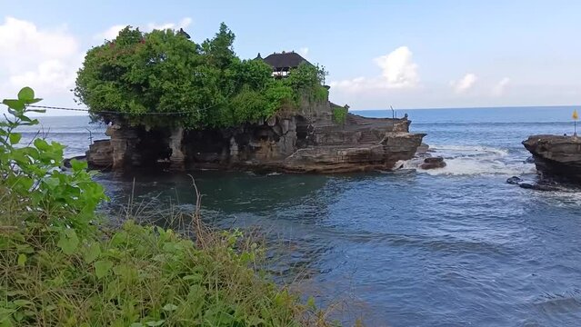 Shot of Tanah Lot temple in Tabanan, Bali, Indonesia. Popular tourist attraction and culture.