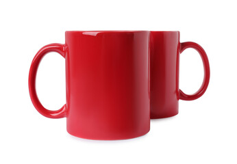 Two red ceramic mugs isolated on white