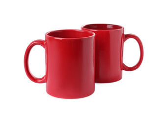 Two red ceramic mugs isolated on white