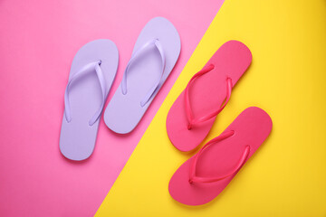 Different stylish flip flops on color background, flat lay