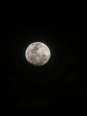 Closeup of the moon illuminating the dark night sky