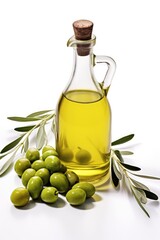 Bottle of olive oil and green olives with leaves
