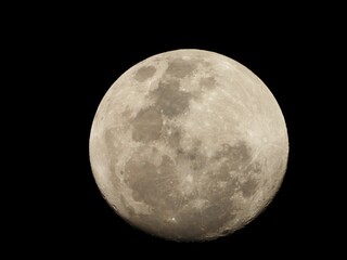 Closeup of the moon illuminating the dark night sky